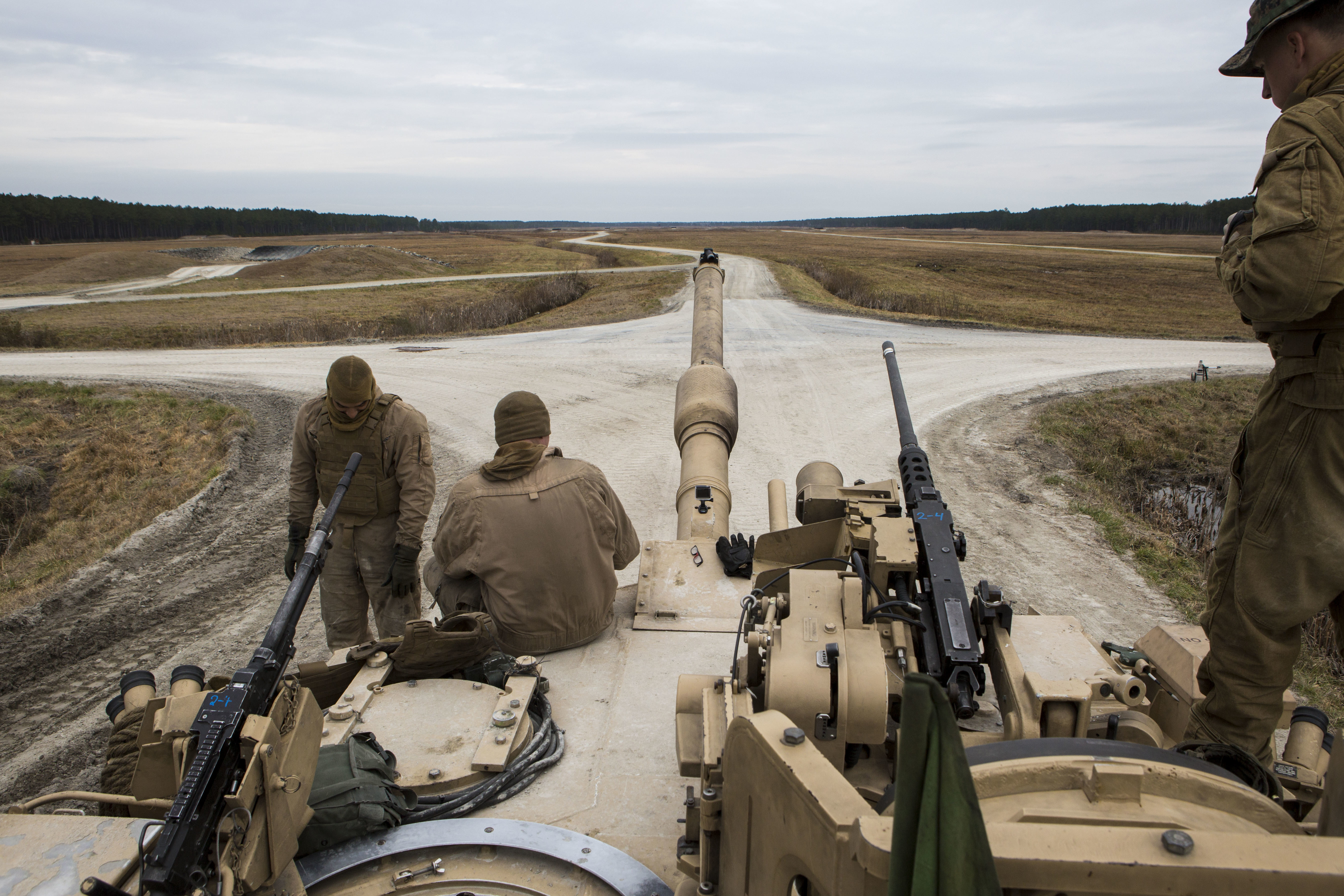 U.S. Marines with Company B, 2nd Tank Battalion, sit on an M1A1 Abrams Main Battle Tank during a live-fire exercise at Range SR-10, Camp Lejeune, N.C., Jan. 28, 2016. 2nd Tank Battalion conducted marksmanship qualifications during a month-long field exercise. (U.S. Marine Corps photo by Lance Cpl. Judith L. Harter, MCIEAST Combat Camera/Released)