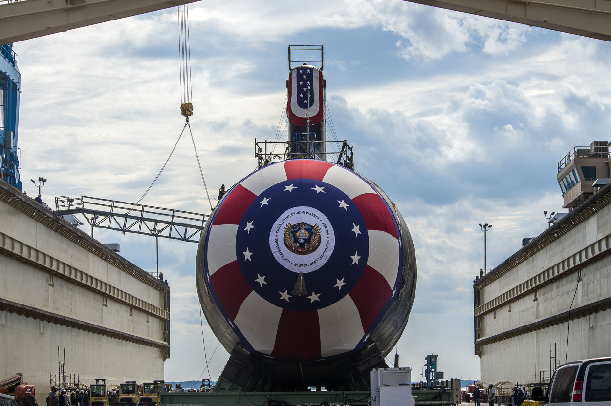 The Virginia-class attack submarine Pre-commissioning unit (PCU) John Warner (SSN 785) is in place on Newport News Shipbuilding’s floating dry dock in preparation for the Sept. 6 christening. The bow flag is about 30 feet in diameter and will be the centerpiece of the christening ceremony. 